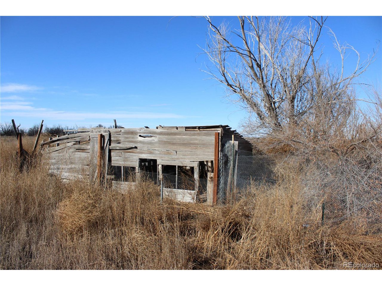 1901 County Rd H Joes, CO 80822 - Photo 15 of 42 a view of a house with a yard