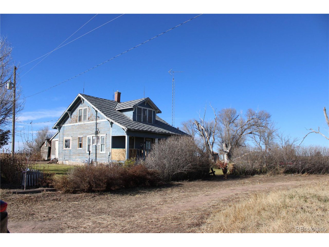 1901 County Rd H Joes, CO 80822 - Photo 18 of 42 a view of a house with a yard