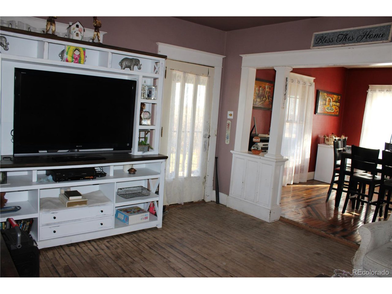 1901 County Rd H Joes, CO 80822 - Photo 32 of 42 a living room with furniture and a flat screen tv