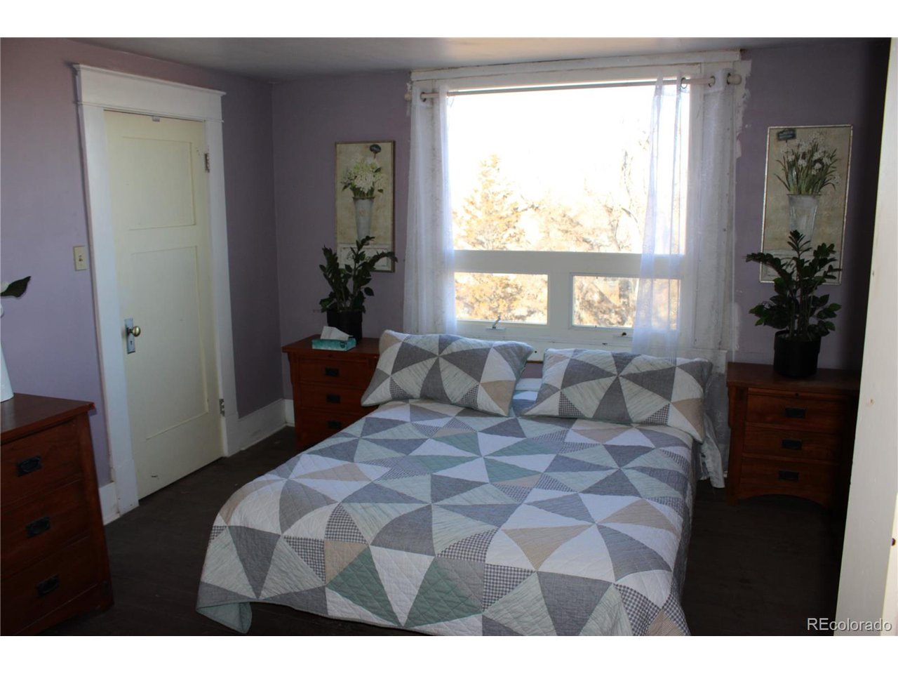 1901 County Rd H Joes, CO 80822 - Photo 39 of 42 a bedroom with a bed and a window