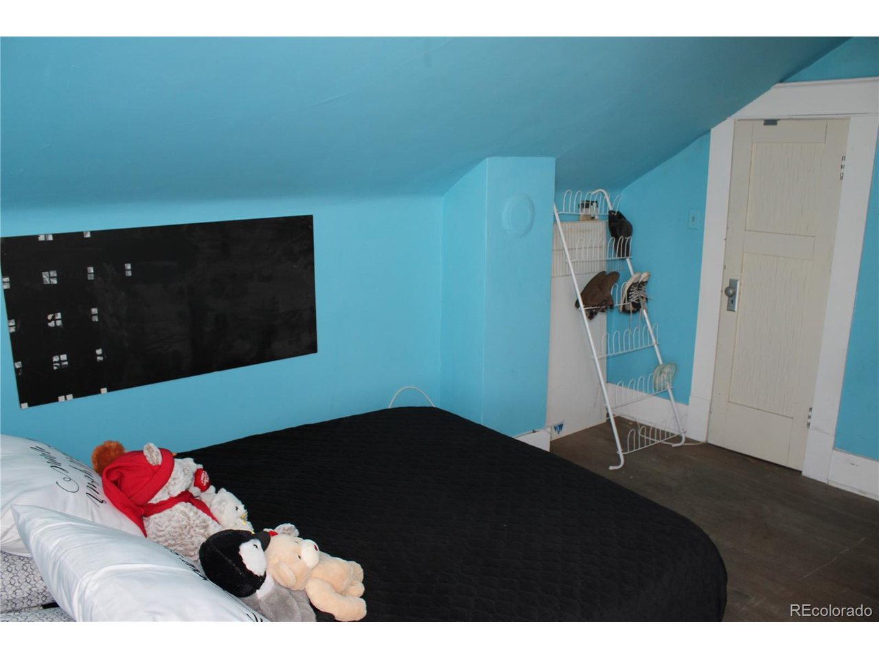 1901 County Rd H Joes, CO 80822 - Photo 41 of 42 a living room with furniture and a floor to ceiling window