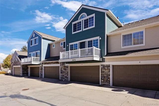 a front view of a house with a garage