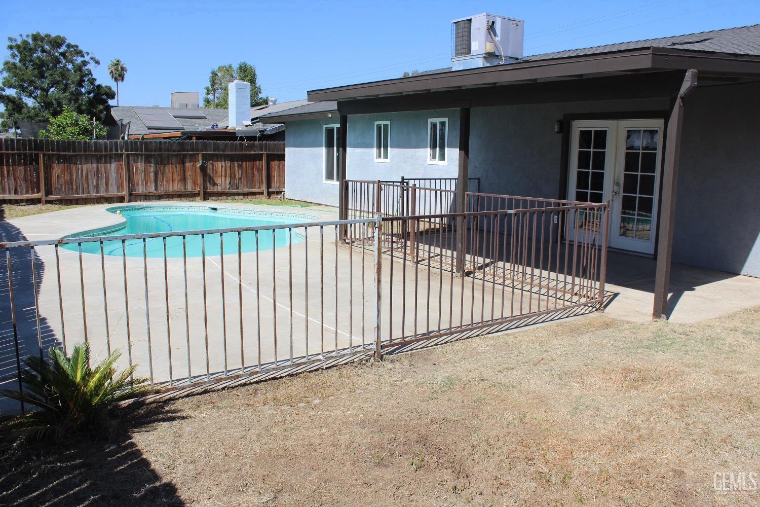 Undisclosed Address Bakersfield, CA 93306 - Photo 12 of 15 a view of a house with a wooden deck