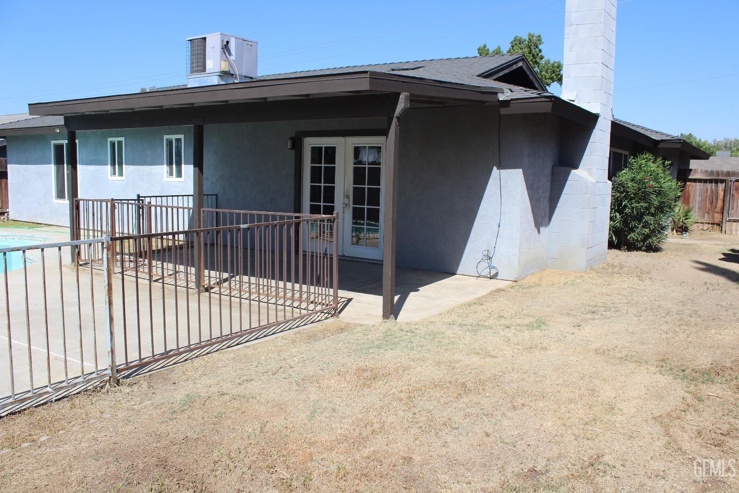 Undisclosed Address Bakersfield, CA 93306 - Photo 13 of 15 a view of a house with wooden fence
