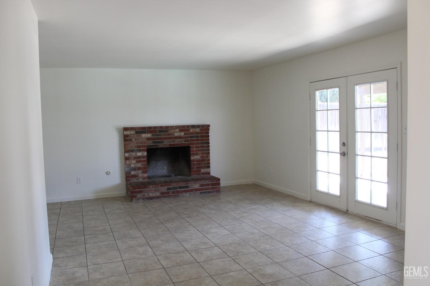 Undisclosed Address Bakersfield, CA 93306 - Photo 2 of 15 an empty room with windows