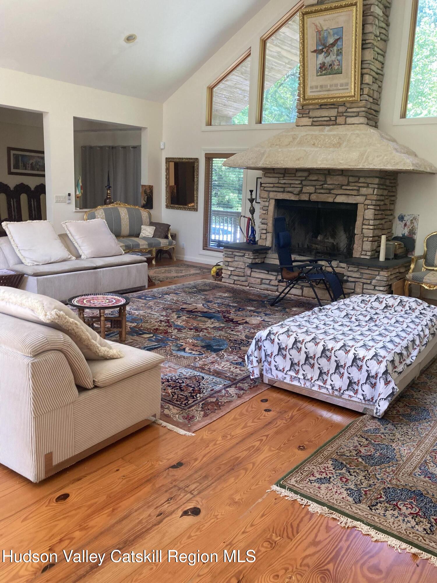 537 Mossy Hill Road Catskill, NY 12414 - Photo 14 of 38 a living room with furniture and a fireplace