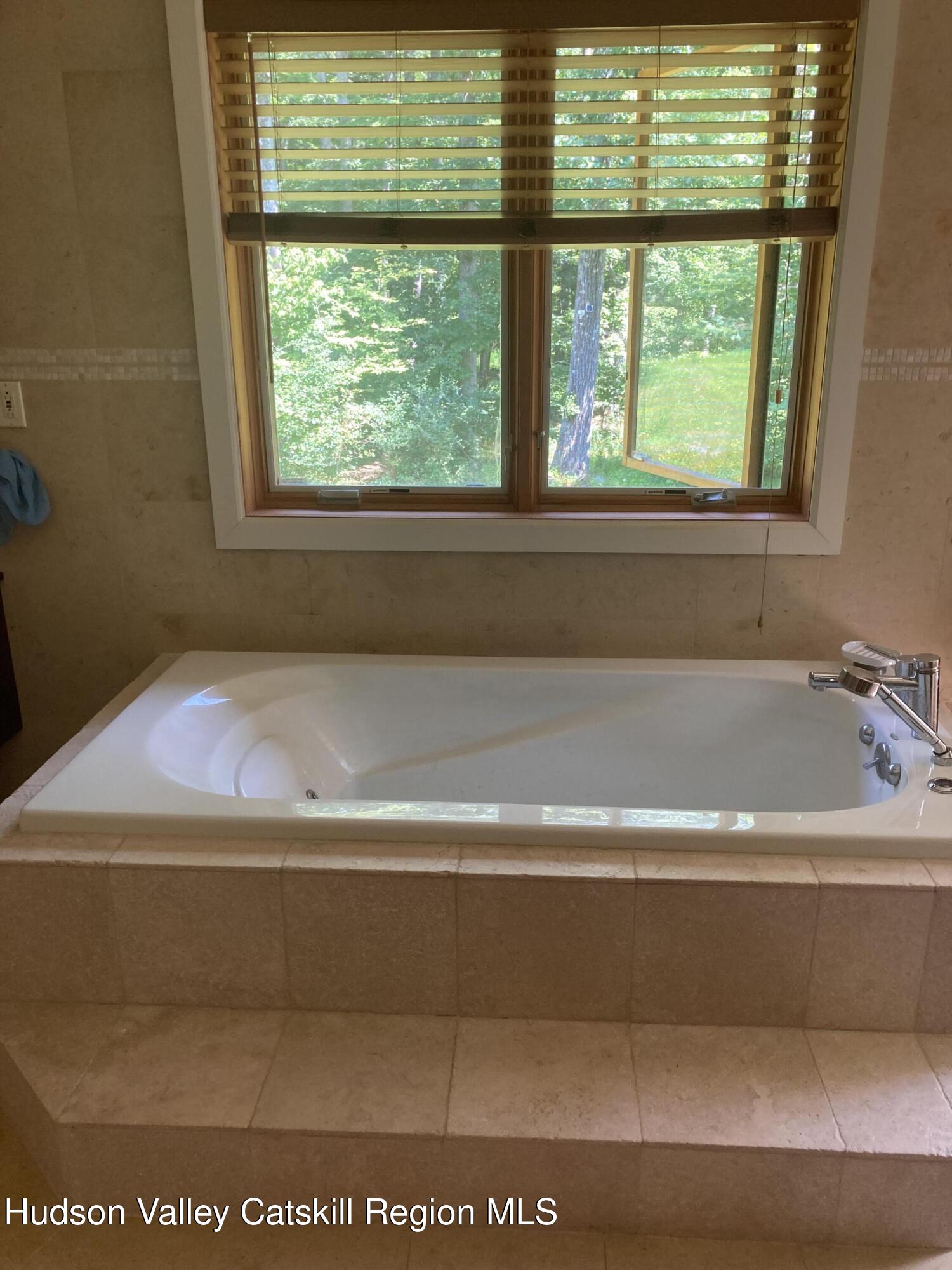 537 Mossy Hill Road Catskill, NY 12414 - Photo 24 of 38 a bathroom with a bathtub