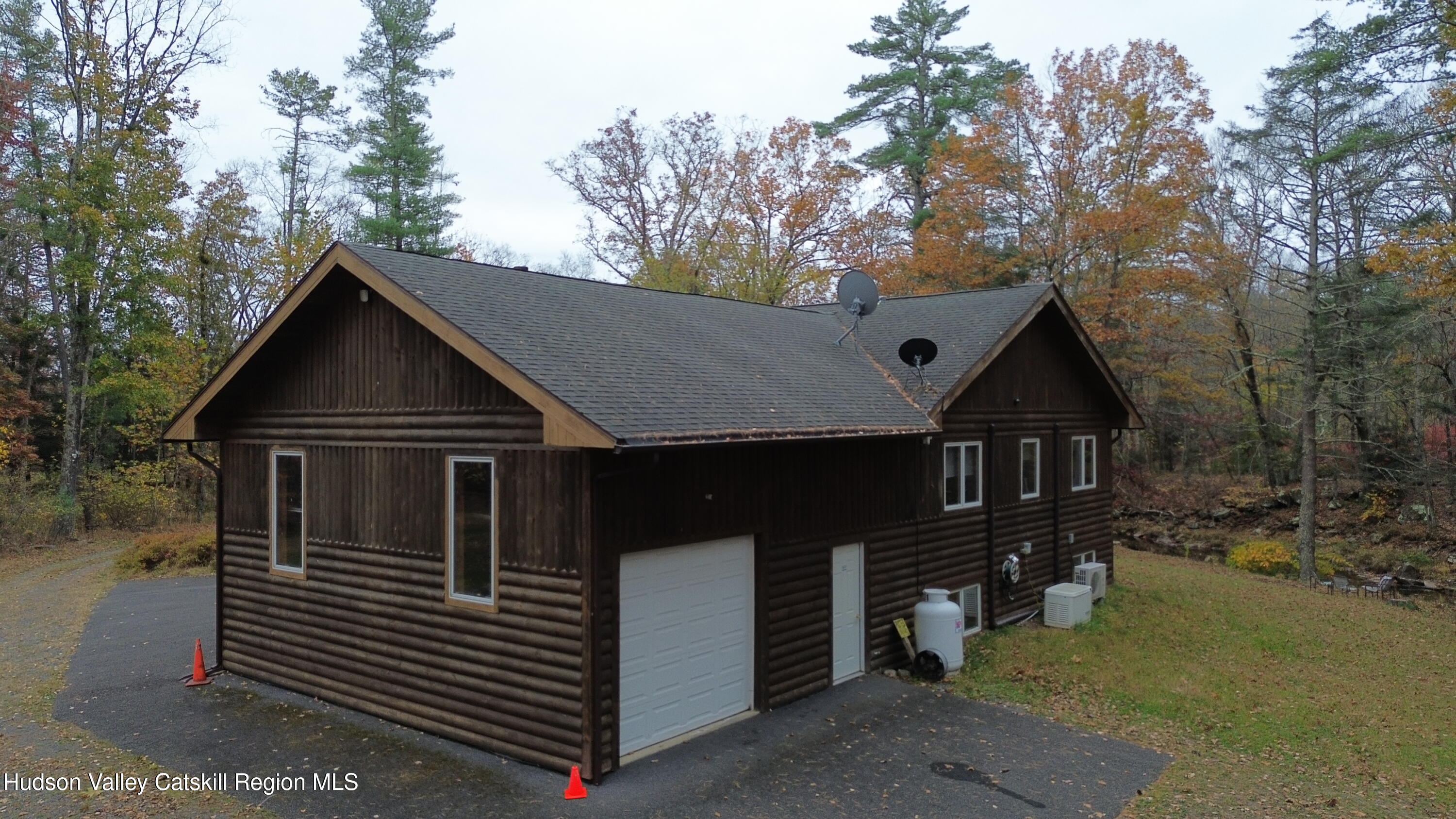 537 Mossy Hill Road Catskill, NY 12414 - Photo 37 of 38 a front view of a house with a yard and garage