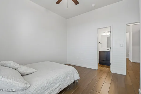 a bedroom with a bed and a walk in closet