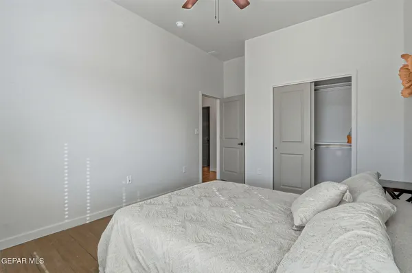 a bedroom with a bed and a lamp
