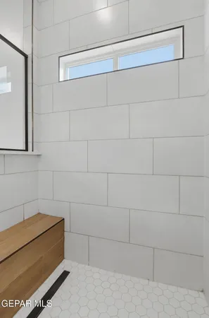 a bathroom with a bathtub and shower