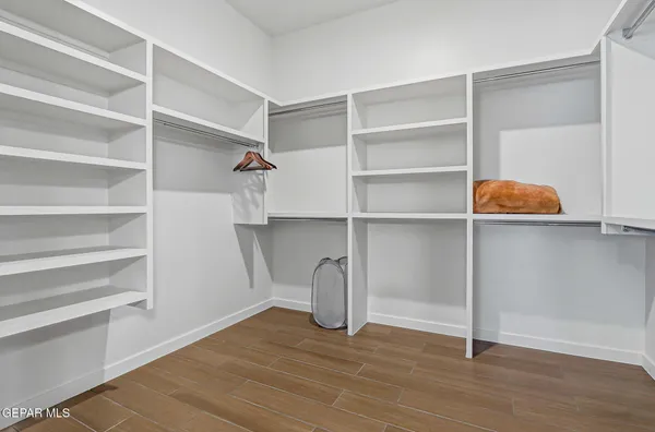 a view of an empty walk in closet