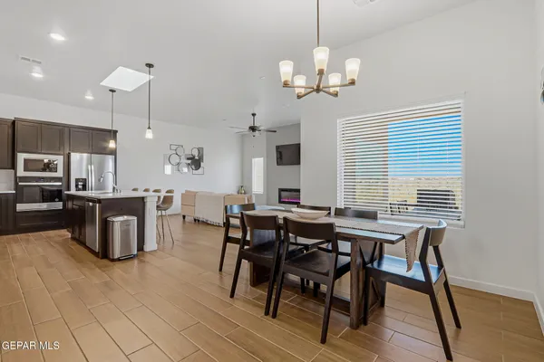 a view of a dining room with furniture and wooden floor