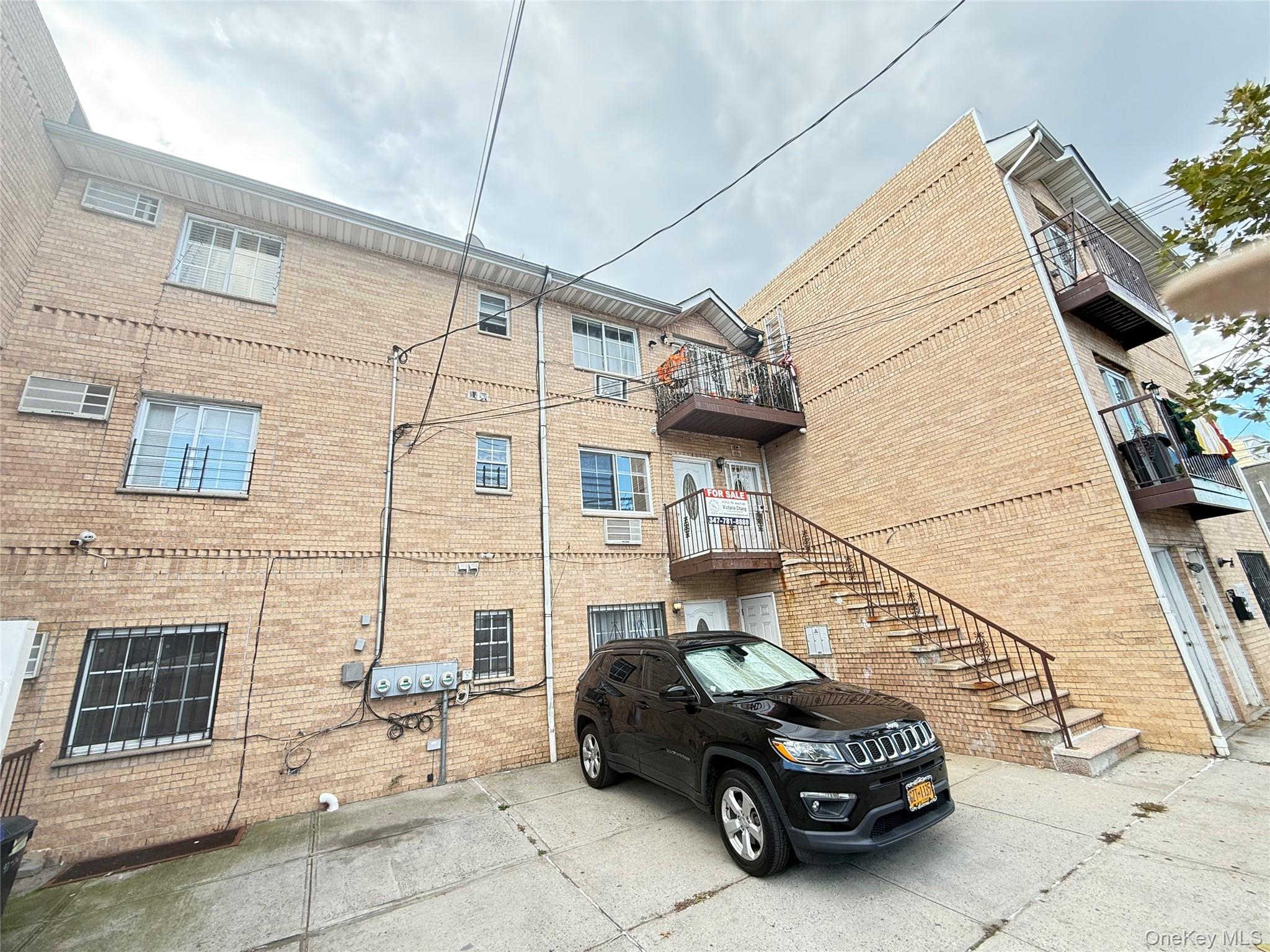 97-56 101st Street Queens, NY 11416 - Photo 12 of 17 a car parked in front of a house