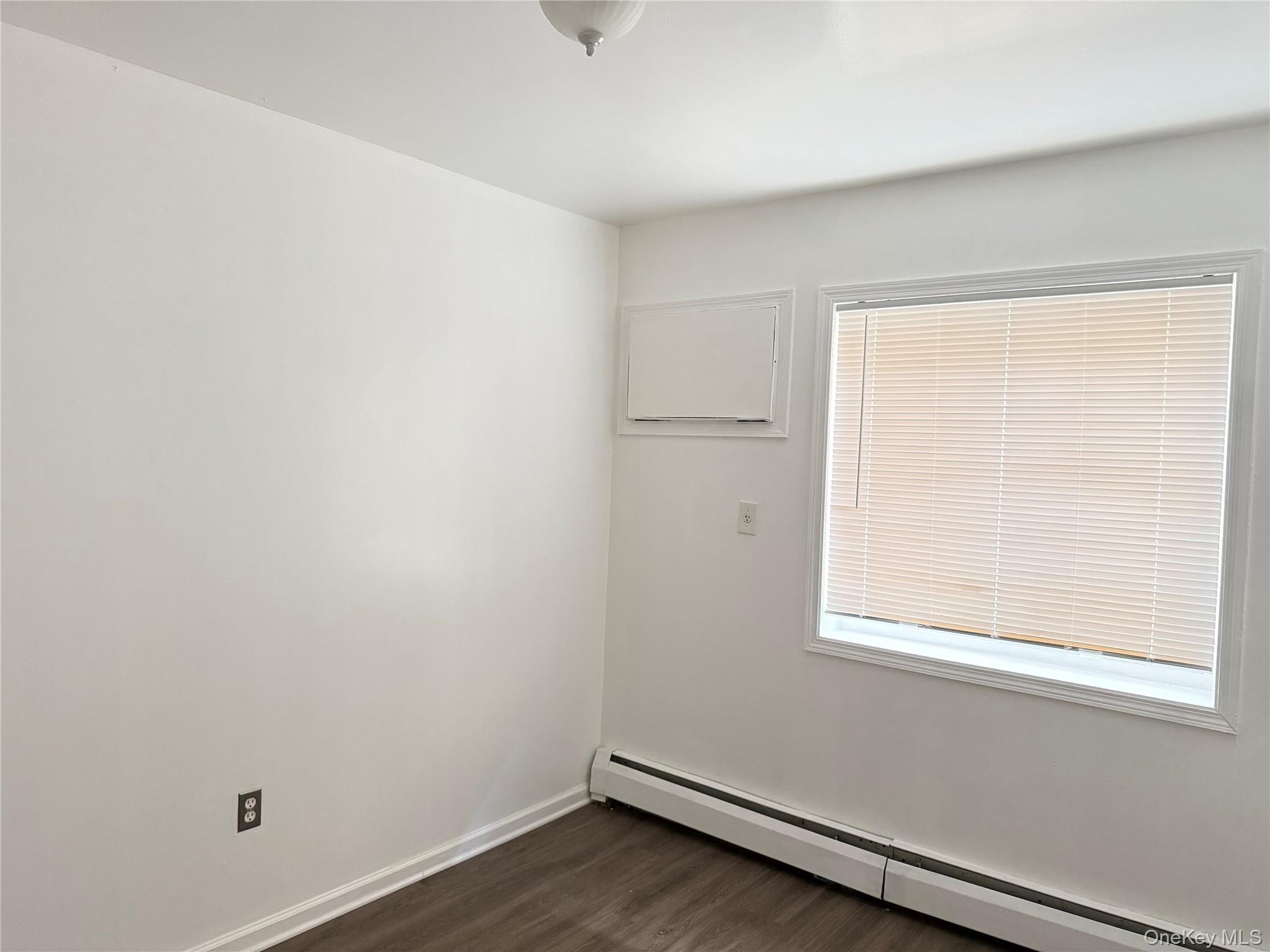 97-56 101st Street Queens, NY 11416 - Photo 15 of 17 an empty room with a window