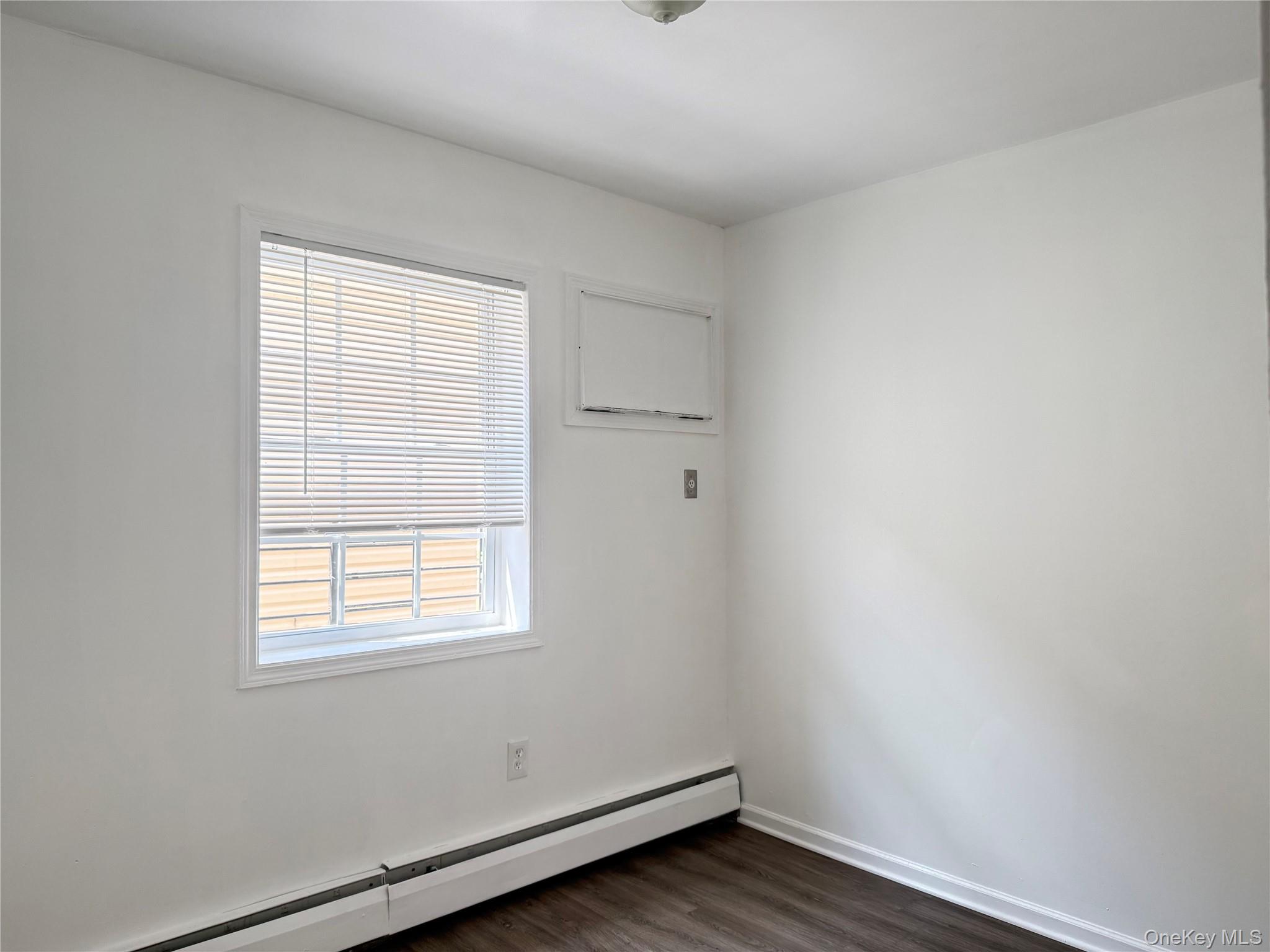 97-56 101st Street Queens, NY 11416 - Photo 6 of 17 an empty room with a window