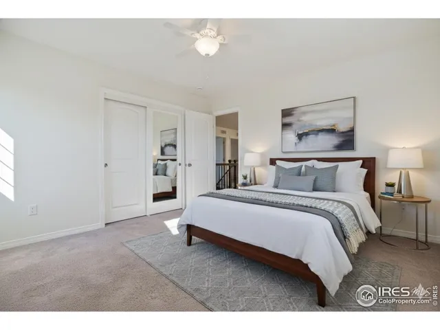 a spacious bedroom with a bed and walk in closet