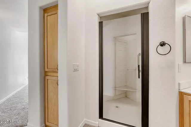 a view of a swimming pool with a lounge chairs