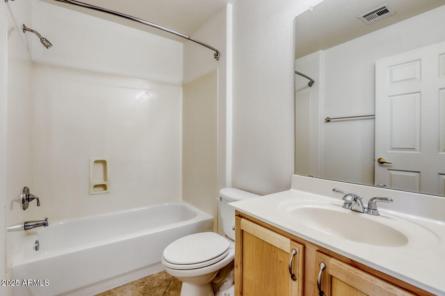 7101 West Beardsley Road, Unit 1403 Glendale, AZ 85308 - Photo 28 of 40 a bathroom with a granite countertop sink toilet and shower