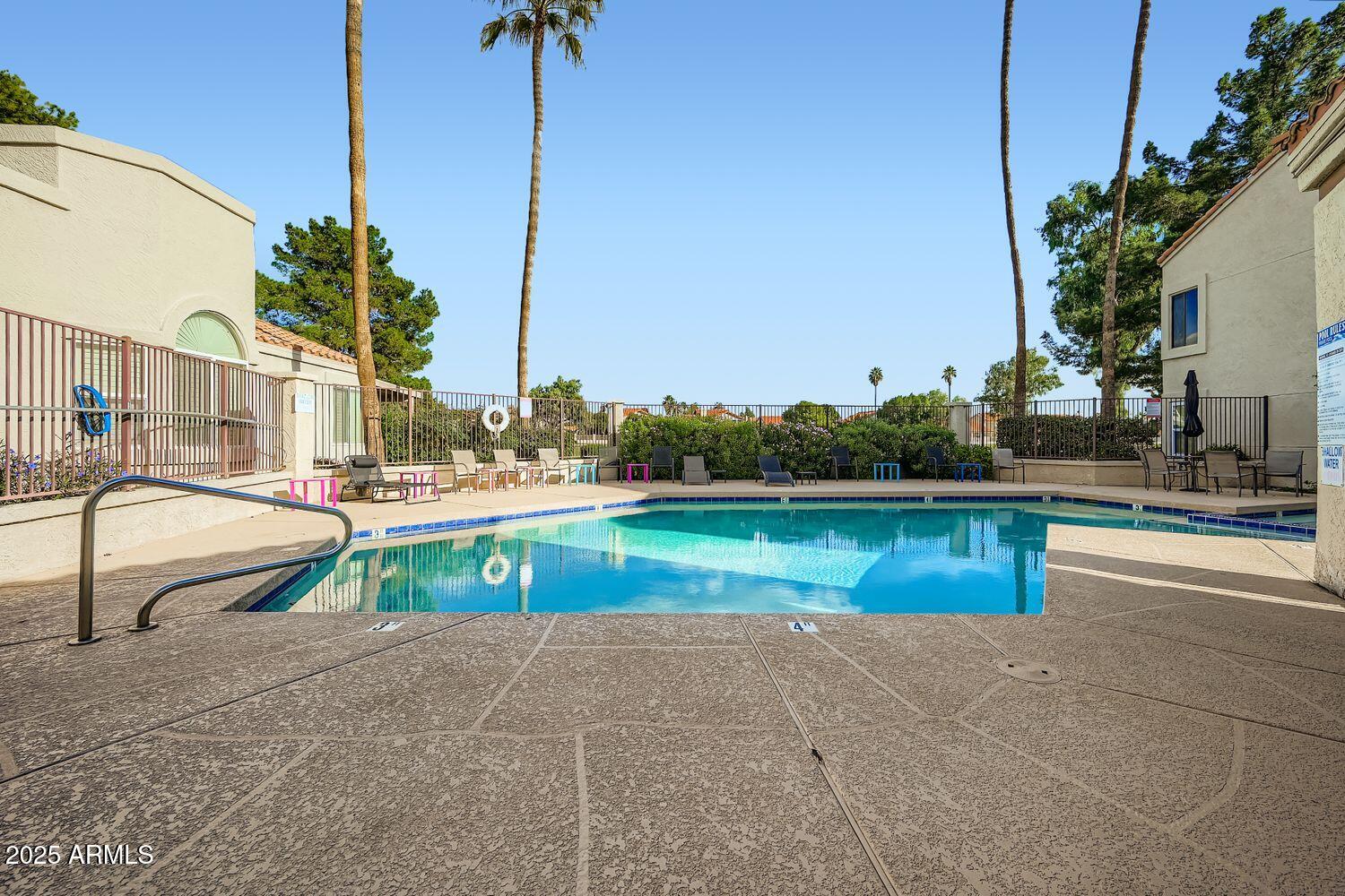 7101 West Beardsley Road, Unit 1403 Glendale, AZ 85308 - Photo 35 of 40 a view of swimming pool with outdoor seating and lake view