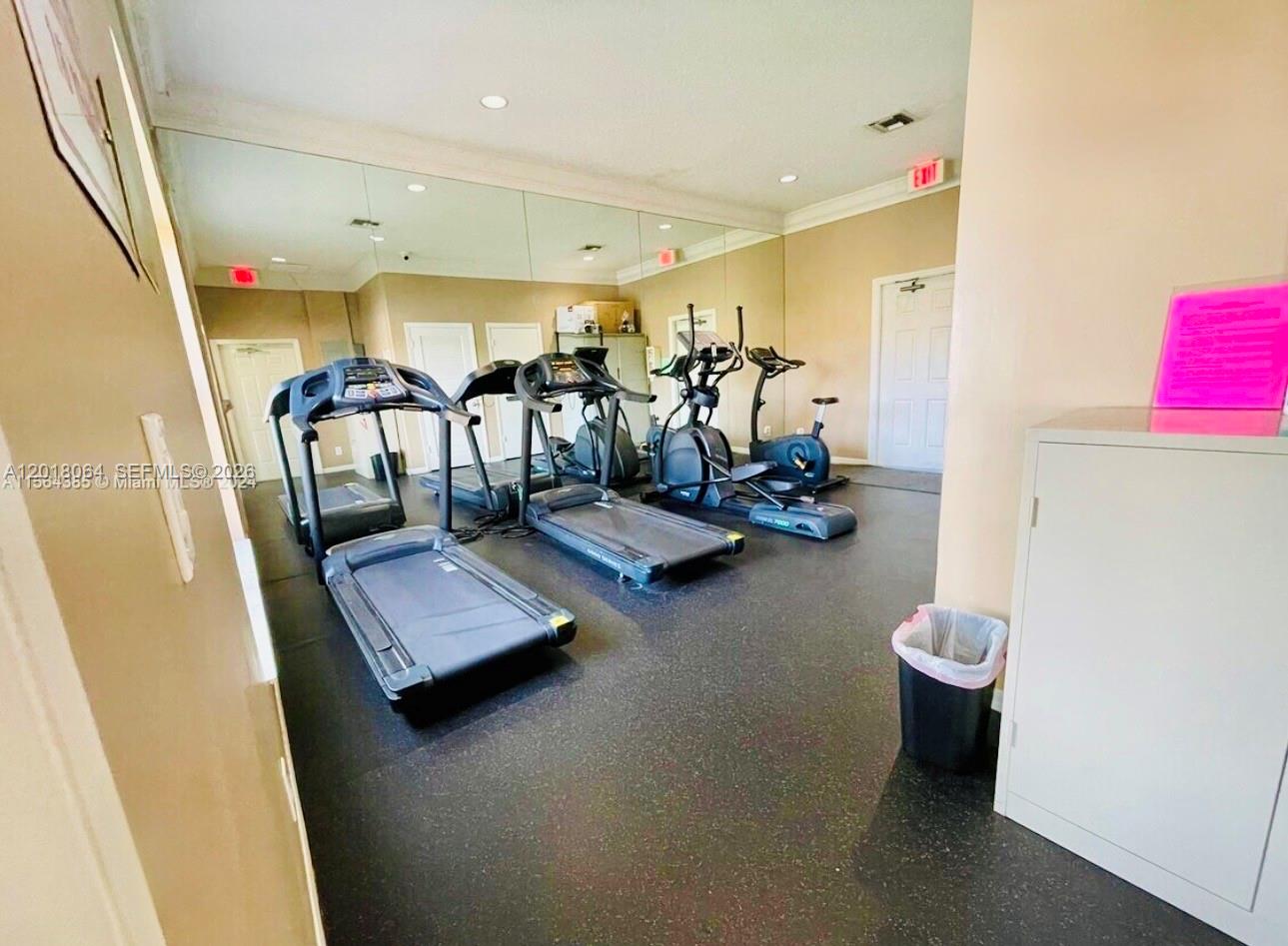 16213 Emerald Cove Road Weston, FL 33331 - Photo 25 of 27 a view of a room with gym equipment