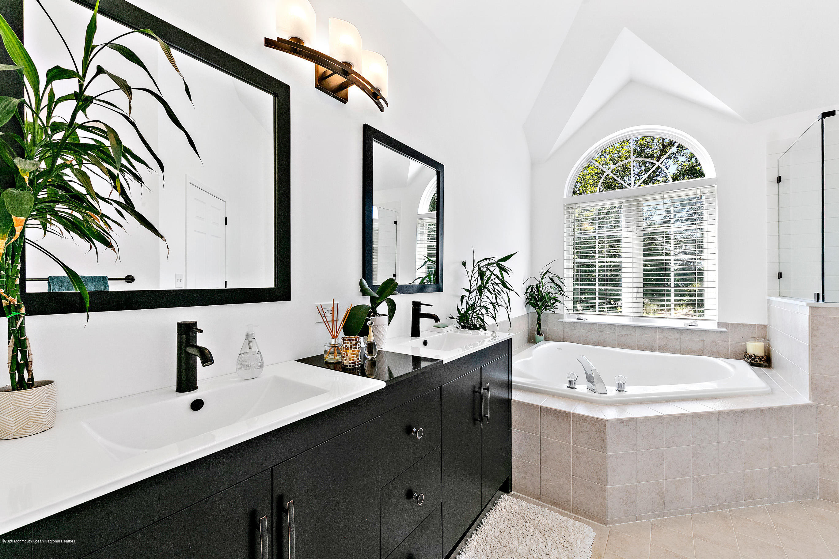 6 Emma Lane Jackson, NJ 08527 - Photo 20 of 39 a bathroom with a tub sink and mirror