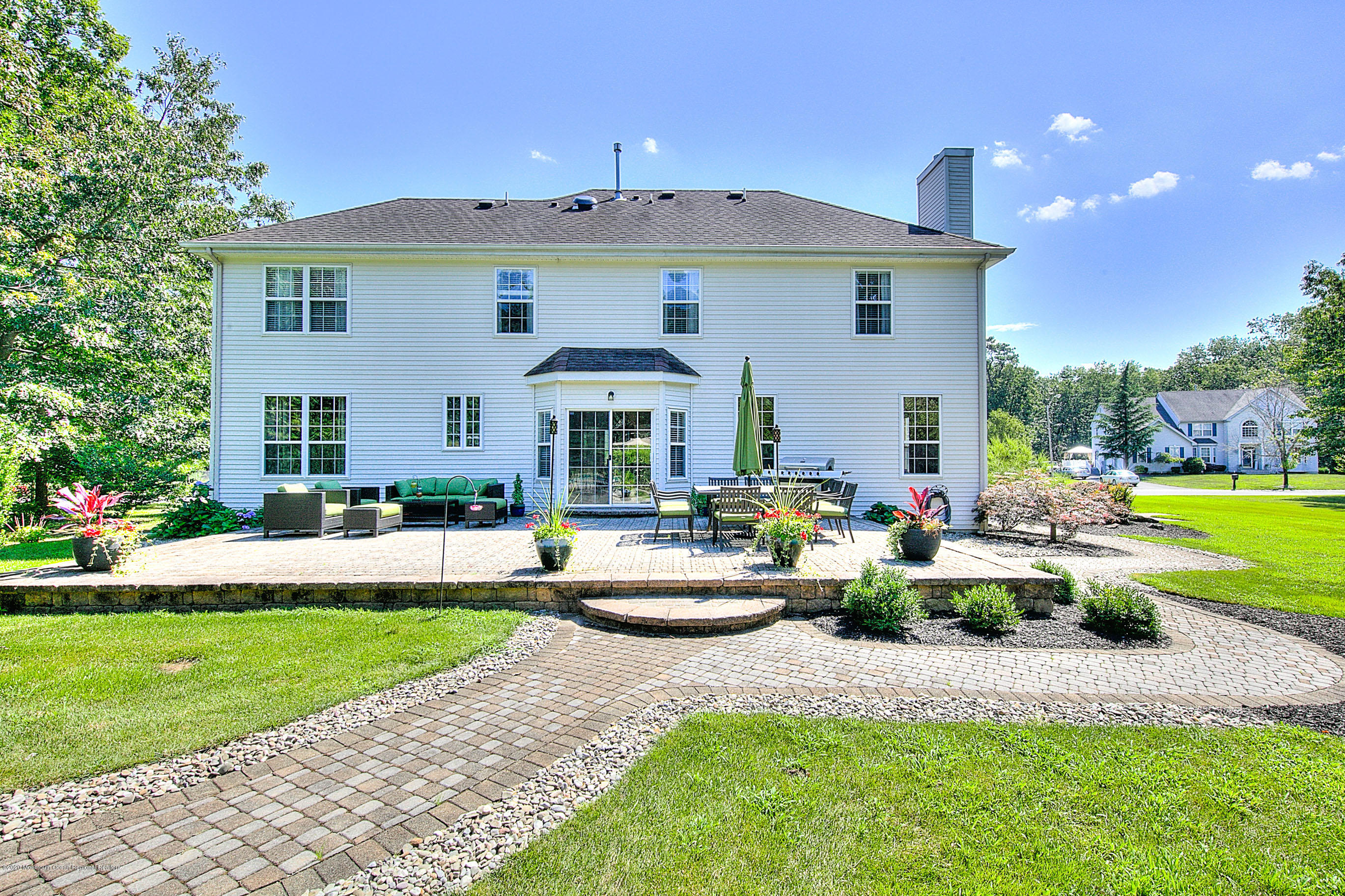 6 Emma Lane Jackson, NJ 08527 - Photo 34 of 39 a front view of a house with garden and porch