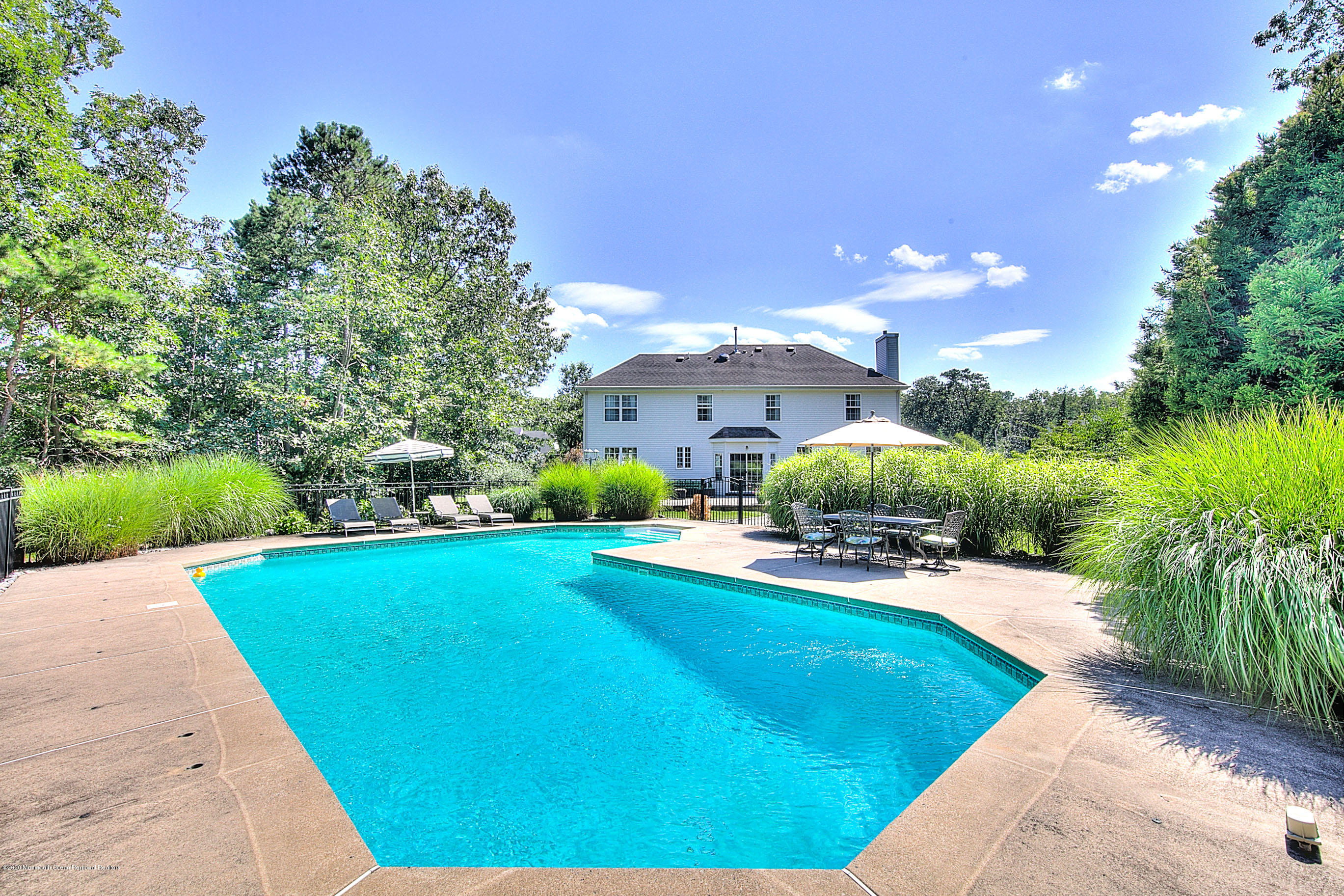 6 Emma Lane Jackson, NJ 08527 - Photo 36 of 39 a view of a backyard with plants and patio