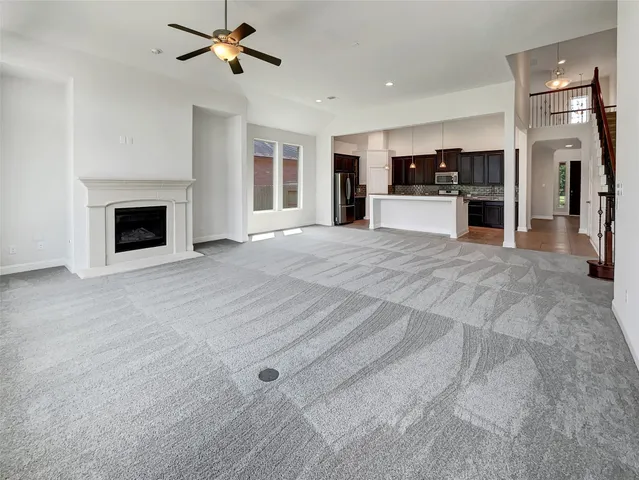 a view of a kitchen with a sink and a fireplace