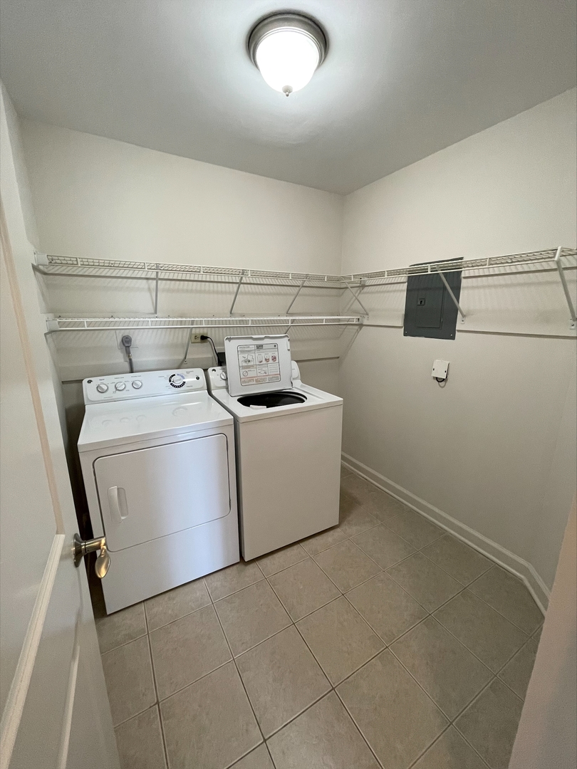 1755 Lake Cook Road, Unit 123 Northbrook, IL 60035 - Photo 4 of 8 a utility room with dryer and washer