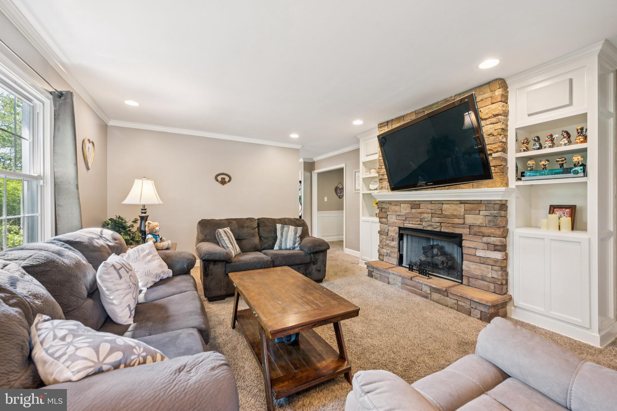 42 Chews Landing Road Clementon, NJ 08021 - Photo 5 of 30 a living room with furniture a fireplace and a flat screen tv