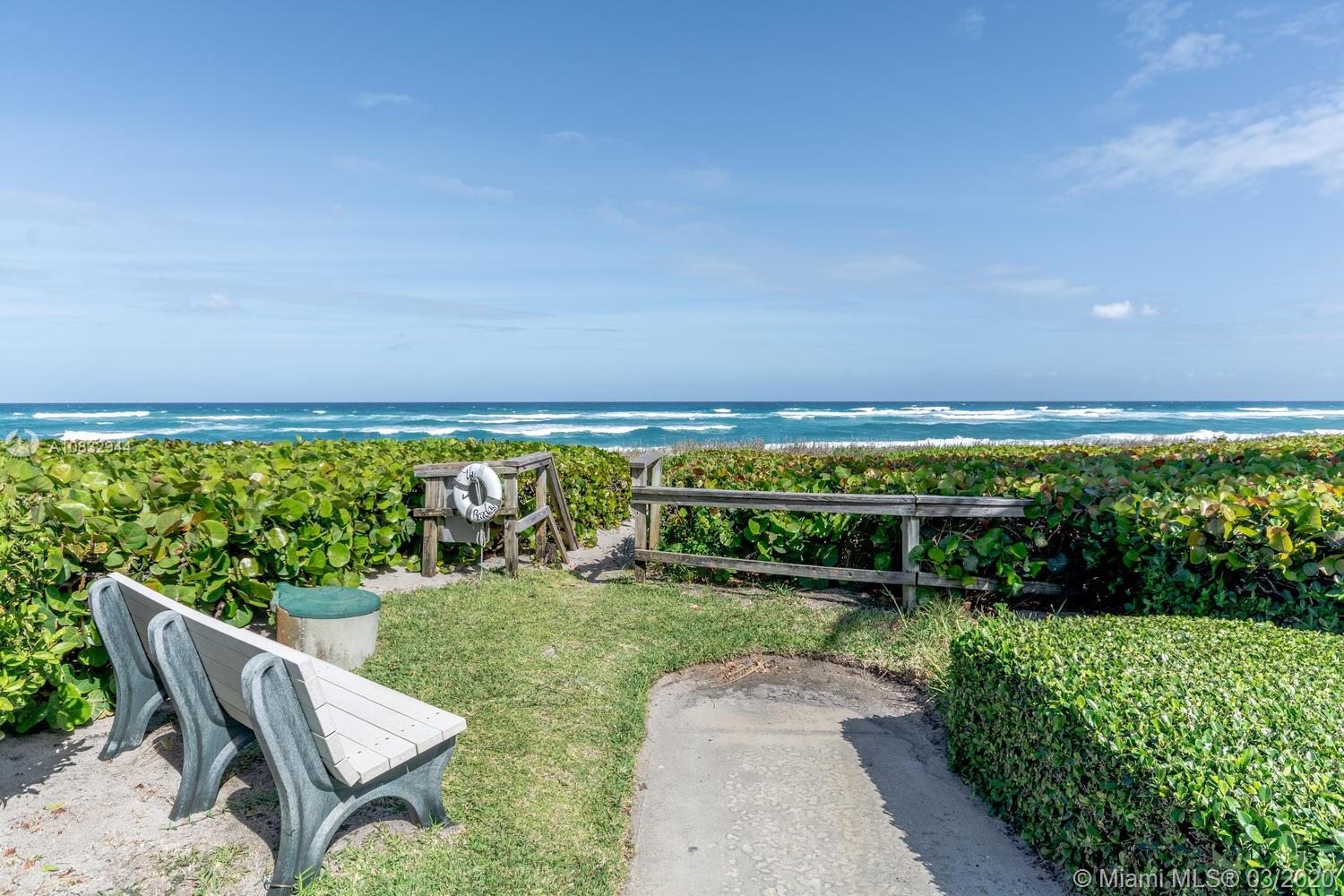 80 Celestial Way, Unit 108 Juno Beach, FL 33408 - Photo 31 of 34 Bench on ocean in front of the development