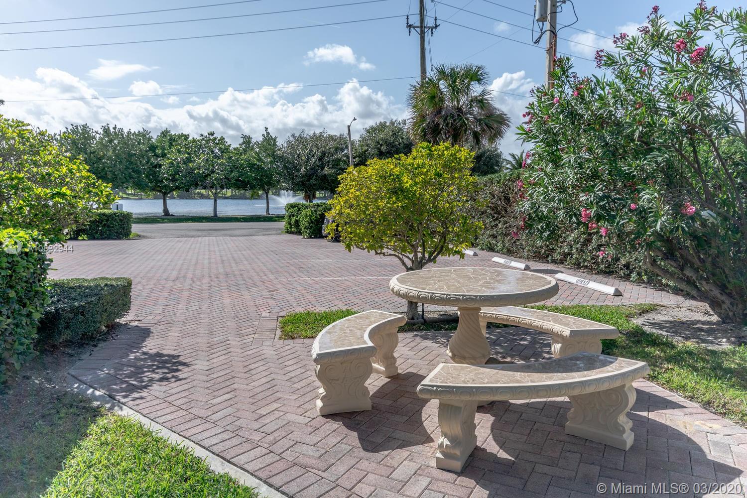 80 Celestial Way, Unit 108 Juno Beach, FL 33408 - Photo 32 of 34 Outdoor dining overlooking Pelican Lake is located just outside the Subject unit.