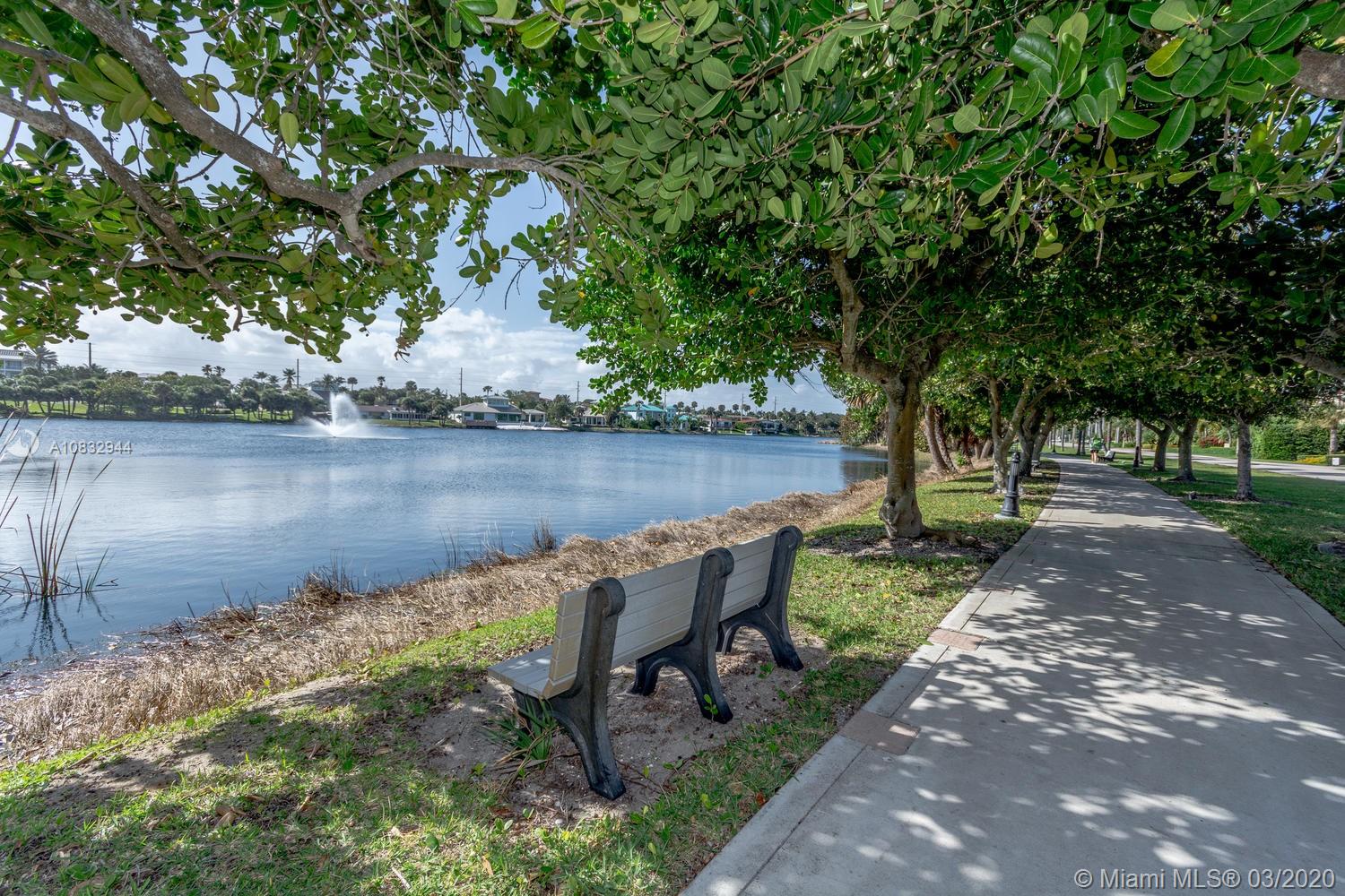 80 Celestial Way, Unit 108 Juno Beach, FL 33408 - Photo 34 of 34 Walkway along lake in front of the unit along Pelican Lake