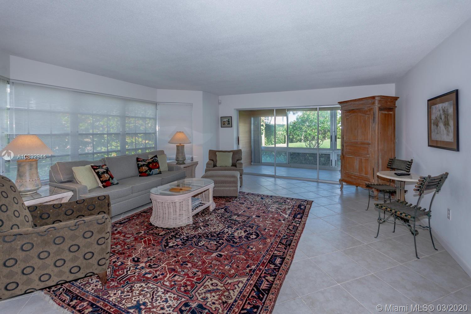 80 Celestial Way, Unit 108 Juno Beach, FL 33408 - Photo 7 of 34 Large living room with tile floors, bay window and view of the grounds.