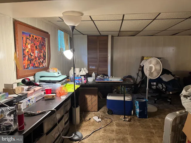 a living room with furniture and a mirror