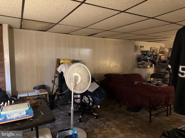 a room with furniture a rug and a window