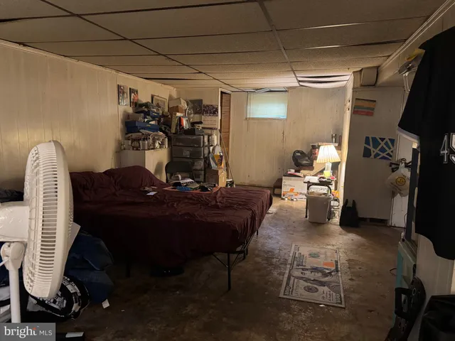 a room with furniture a flat screen tv and a table