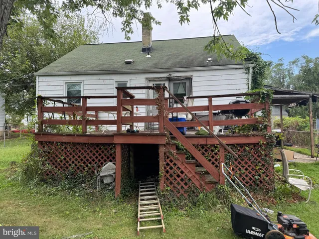 a view of a house with a wooden deck