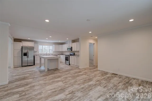 a view of kitchen with wooden floor