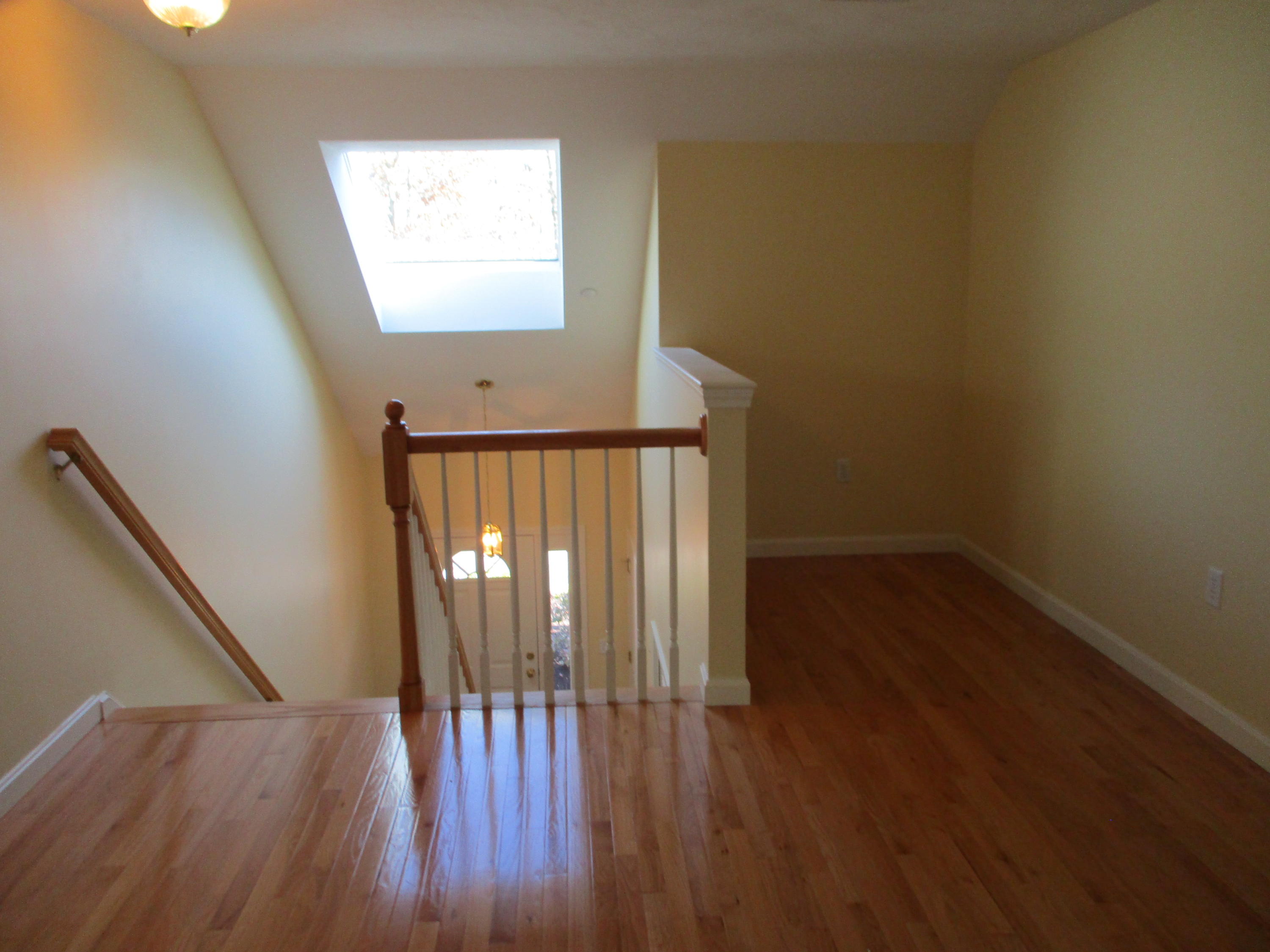 13 North Ridge Road, Unit 440 Mashpee, MA 02649 - Photo 22 of 30 a view of hallway with wooden floor