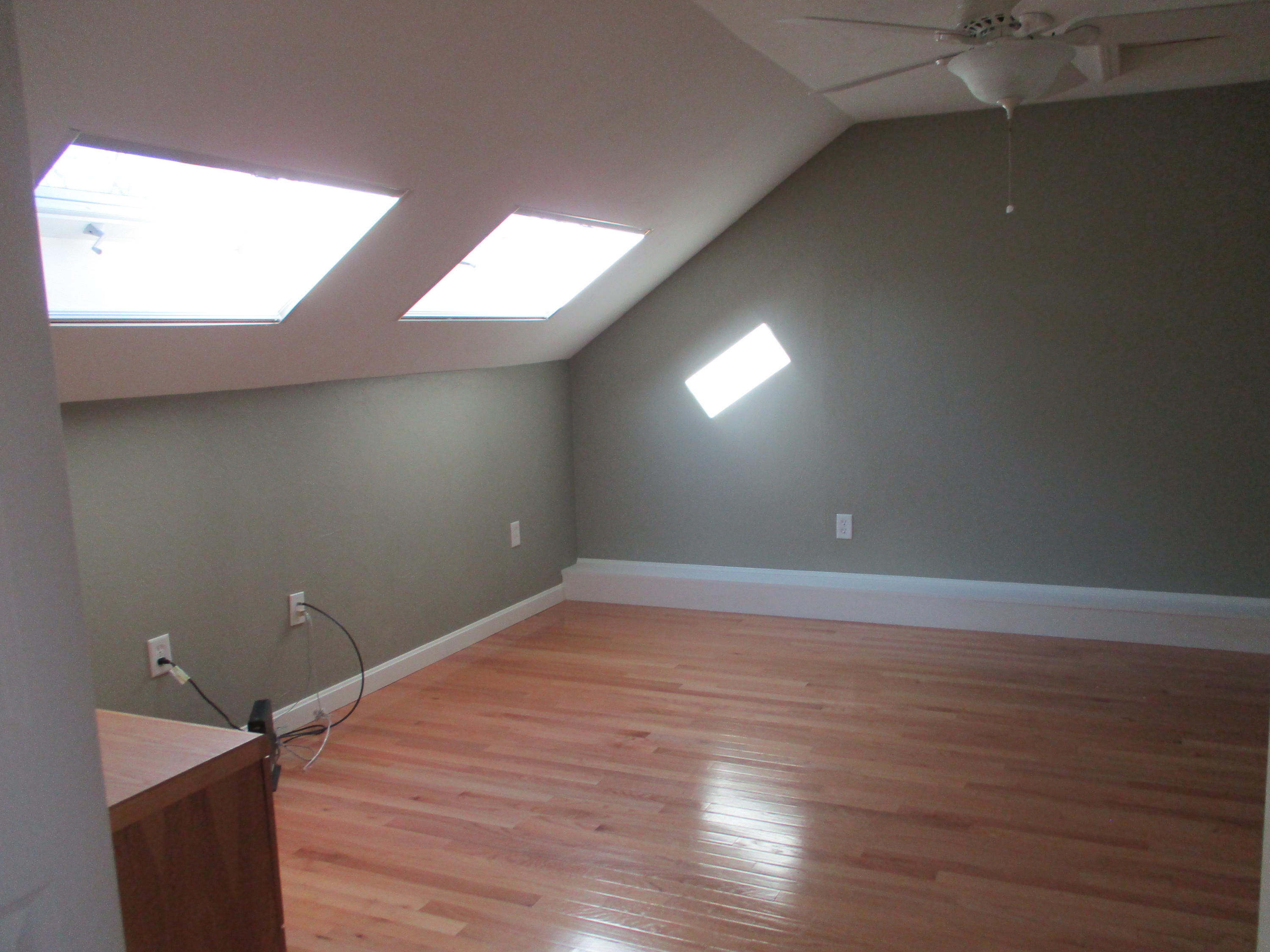 13 North Ridge Road, Unit 440 Mashpee, MA 02649 - Photo 23 of 30 a view of an empty room with wooden floor and a window