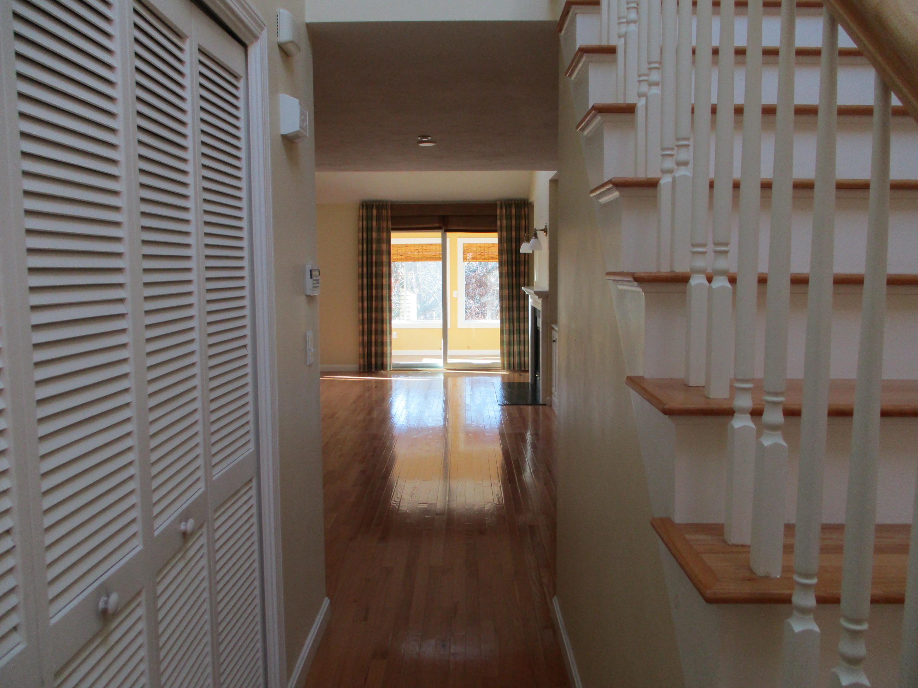 13 North Ridge Road, Unit 440 Mashpee, MA 02649 - Photo 3 of 30 a view of entryway and hall with wooden floor
