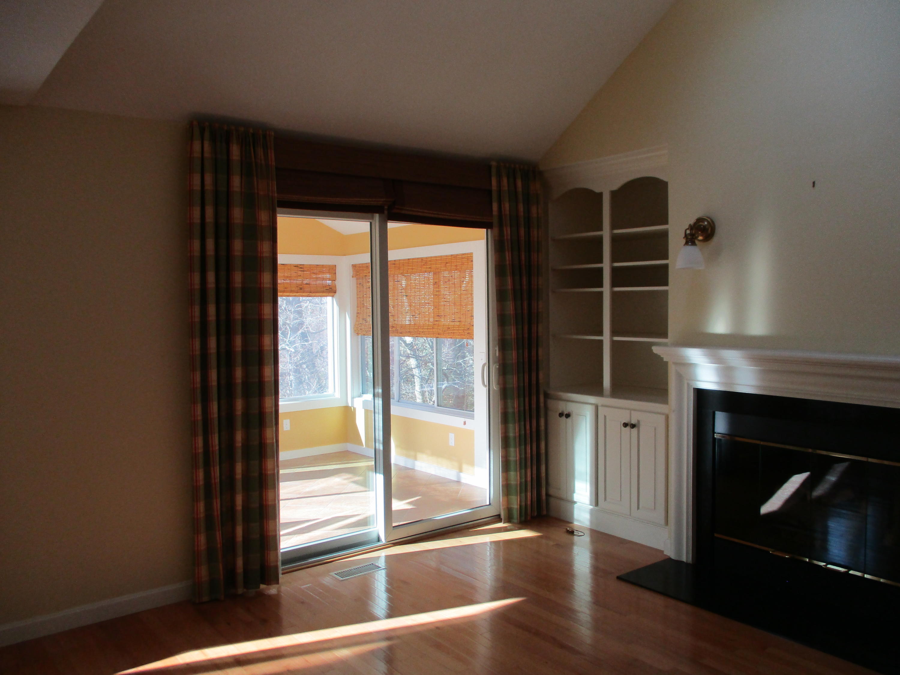 13 North Ridge Road, Unit 440 Mashpee, MA 02649 - Photo 7 of 30 a view of an empty room with wooden floor and a window