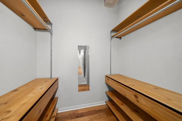 a view of room with wooden floor