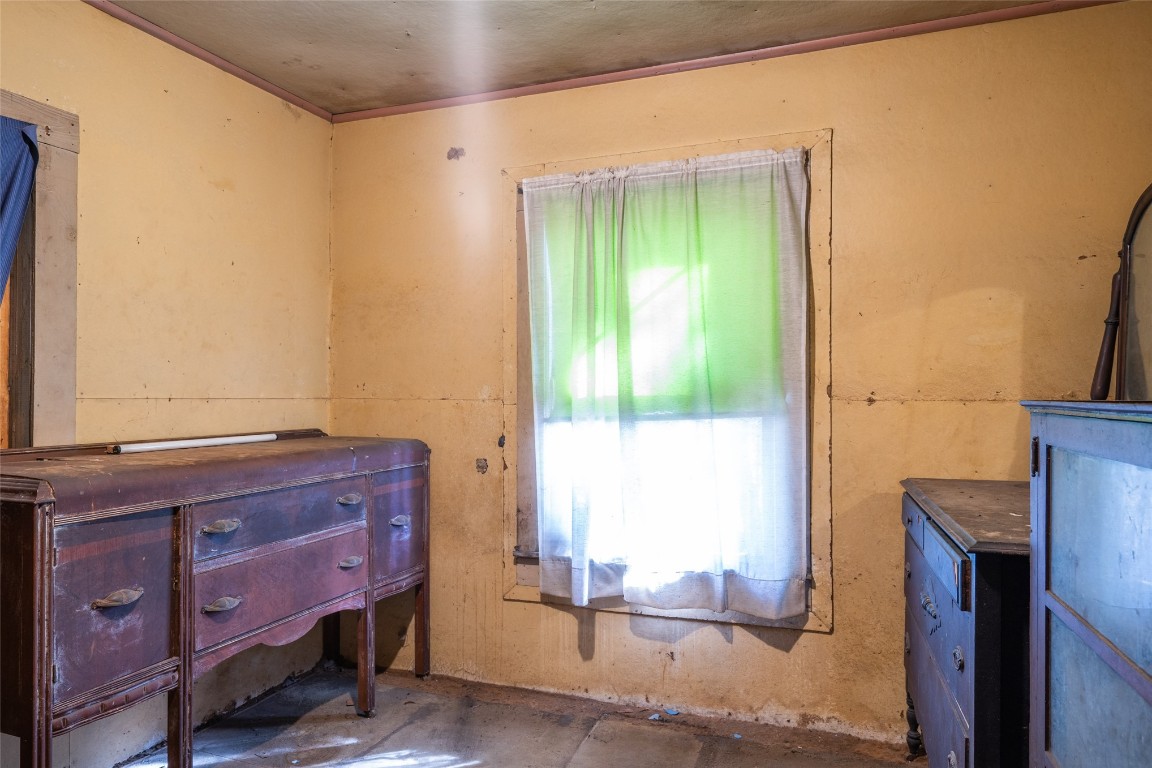 464135 State Road 200 Yulee, FL 32097 - Photo 18 of 27 a room with a dresser next to a window