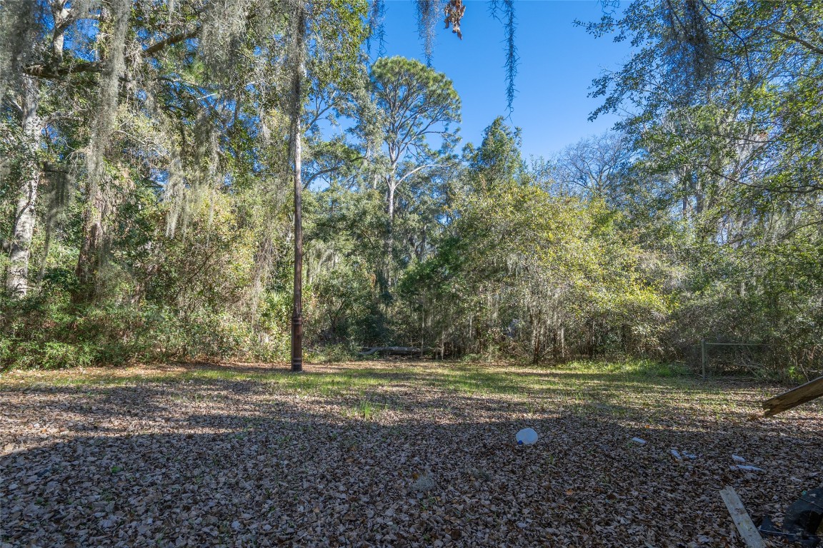 464135 State Road 200 Yulee, FL 32097 - Photo 26 of 27 a view of outdoor space with trees