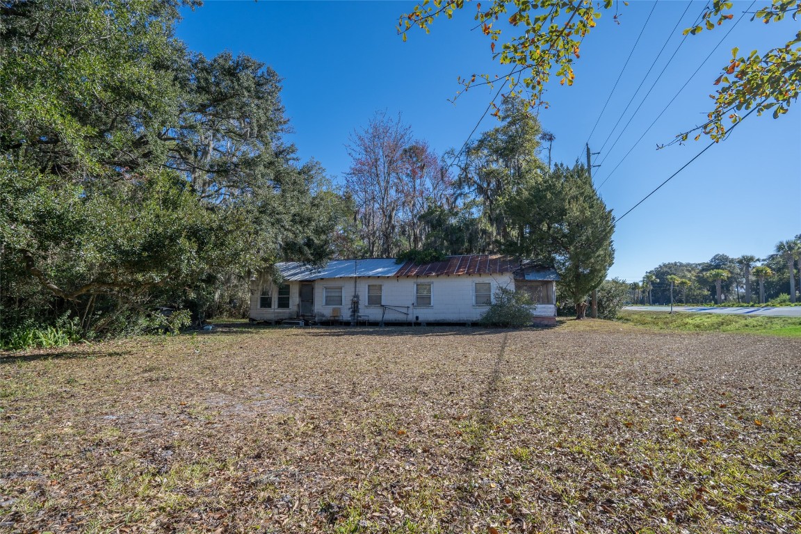 464135 State Road 200 Yulee, FL 32097 - Photo 8 of 27 a front view of a house with a yard