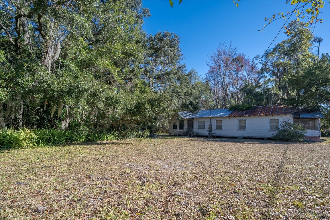 464135 State Road 200 Yulee, FL 32097 - Photo 9 of 27 a view of a yard with trees