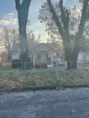 a view of open space in front of a house